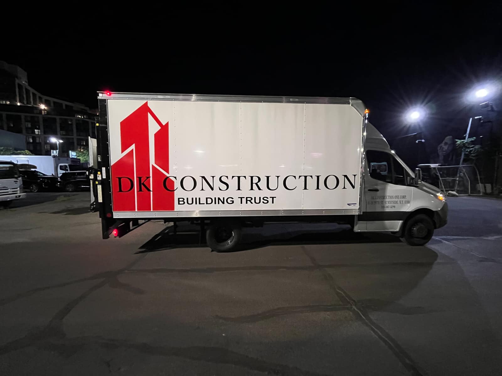 DK Construction box truck with a printed commercial wrap by NYC Car Wraps
