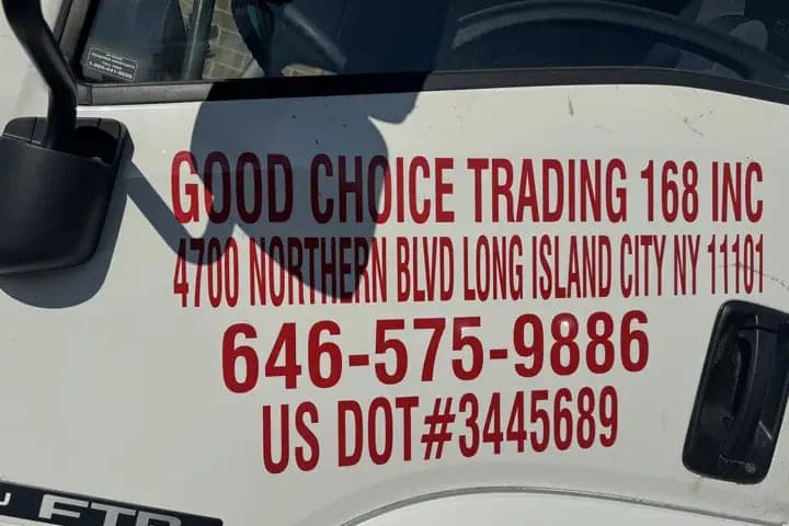 Close-up of white truck door lettering for Good Choice Trading 168 Inc with the 4700 Northern Blvd Long Island City address, phone number and US DOT number
