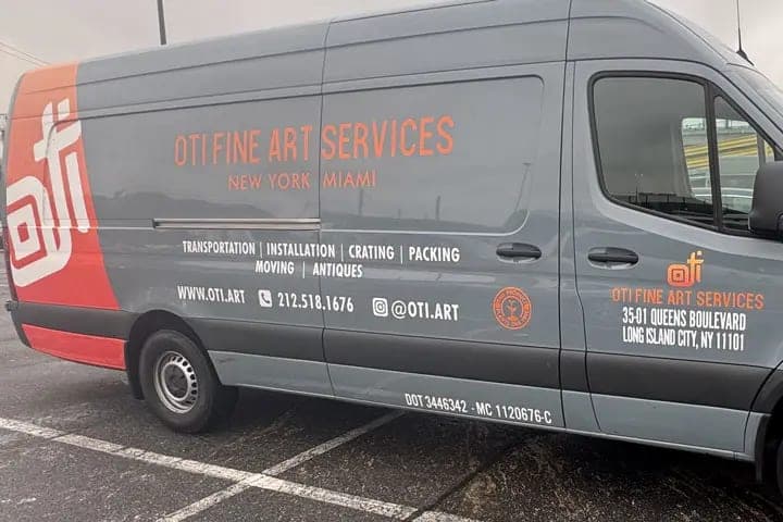 Grey Mercedes Sprinter for OTI Fine Art Services with orange and white cut lettering and a Queens Blvd, Long Island City address