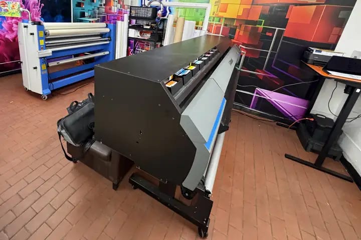 Large-format printer in the NYC Car Wraps print room